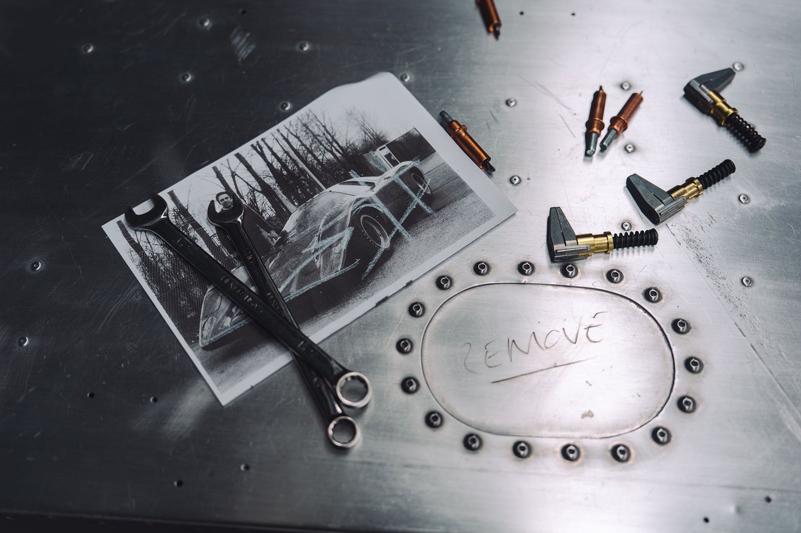 A period photo of the M6GT and its original build tools, kept on the bench throughout MSO's 3,000-hour restoration.